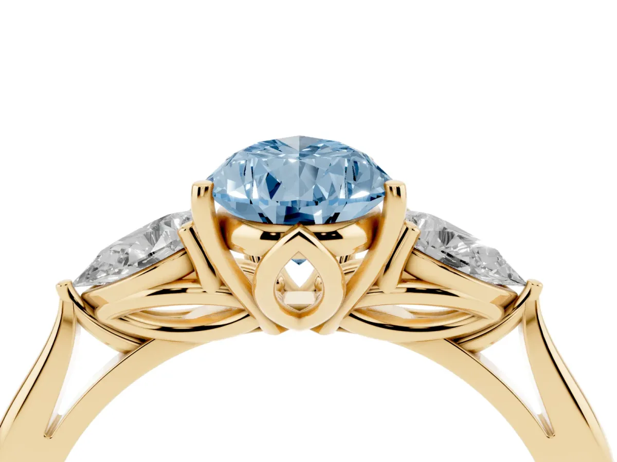 Fancy Blue Pear Cut Diamond Three-Stone Ring with Pear Side Stones and Prong Setting Yellow gold