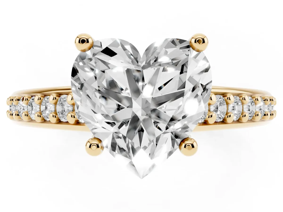 Heart Cut Solitaire Prong Set Diamond Engagement Ring with Pave Band Yellow gold