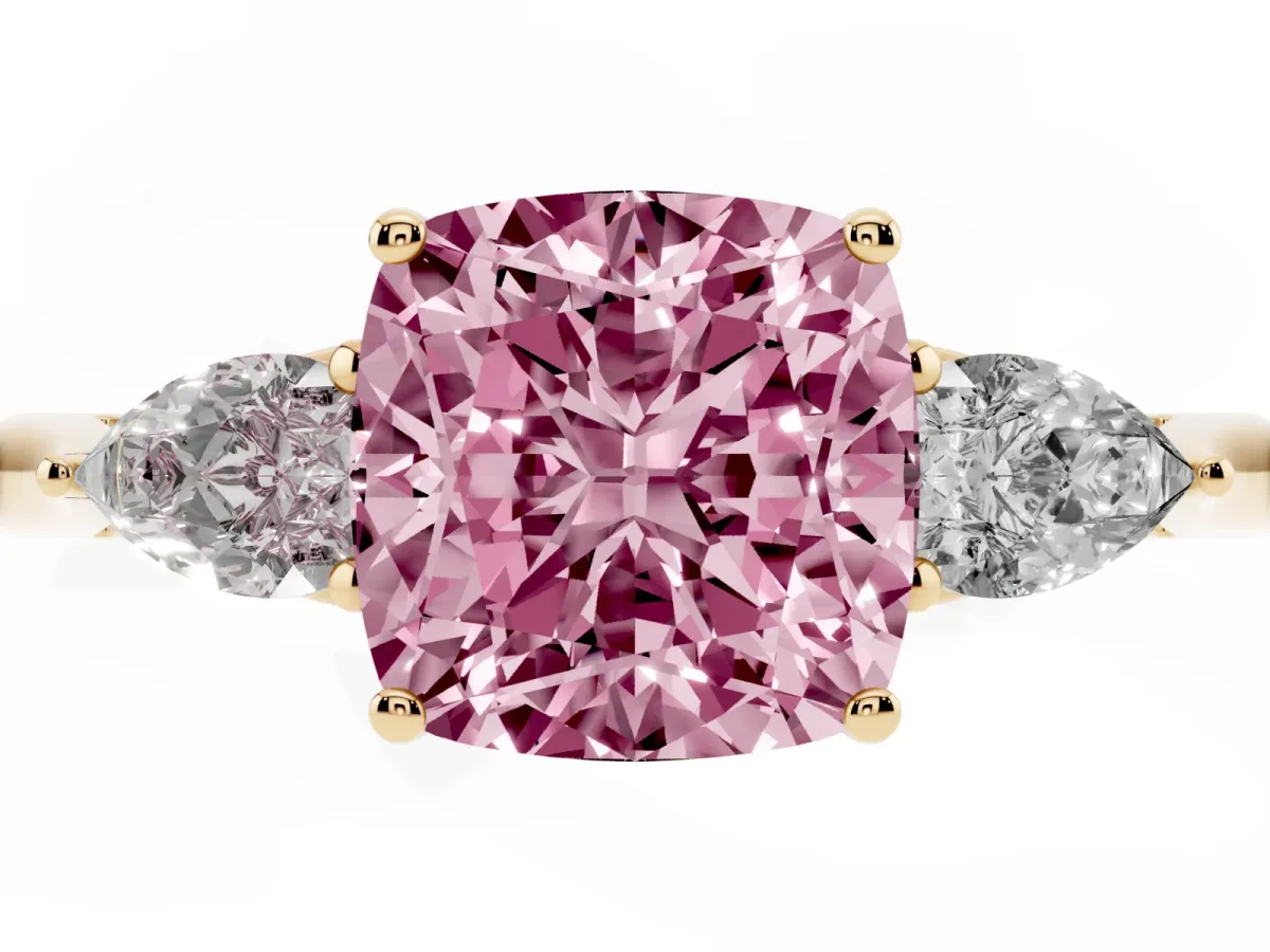 Fancy Pink Three-Stone Cushion Cut Diamond Ring with Pear Side Stones in Four-Prong Setting Yellow gold