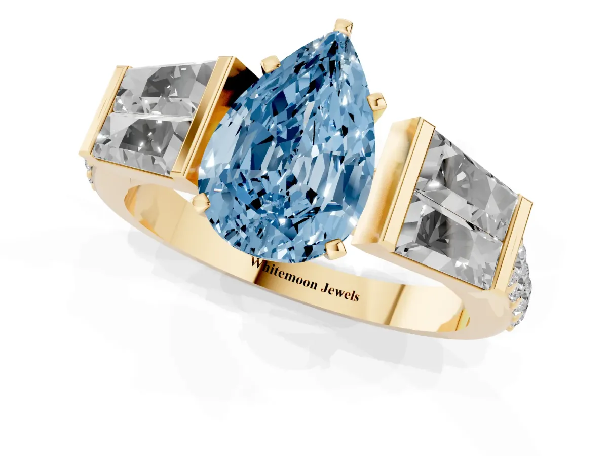 Fancy Blue Pear Cut Diamond Engagement Ring with Baguette Side Stones and Channel Set Band Yellow gold