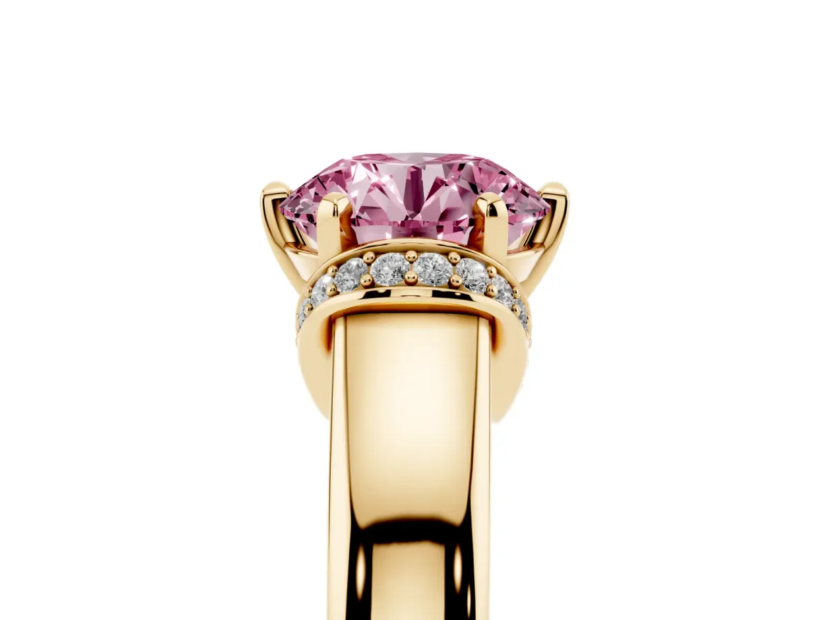 Fancy Pink Round Cut Solitaire Diamond Ring with Pave Band and Six-Prong Setting Yellow gold