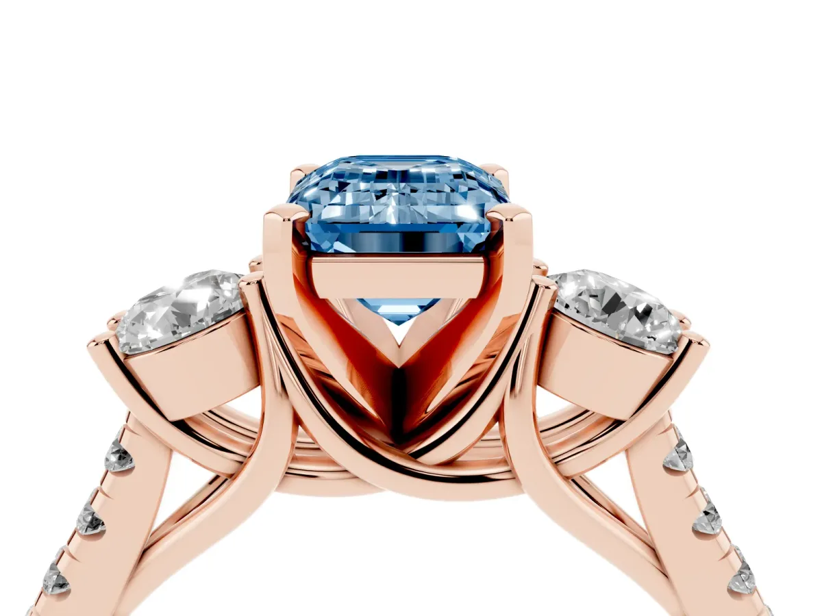 Fancy Blue Three-Stone Emerald Cut Diamond Pavé Band with Four-Prong Setting Rose gold