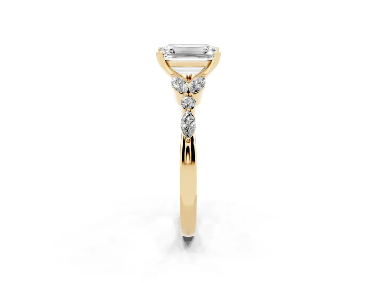 Emerald Cut Diamond Solitaire Ring with Side Stones and Four-Prong Setting Yellow gold
