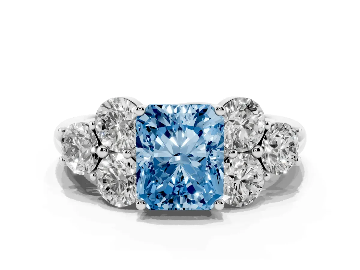Fancy Blue Radiant Cut Cut Diamond Cluster Ring with Round Accent Stones and Prong Setting on a Classic Band White gold