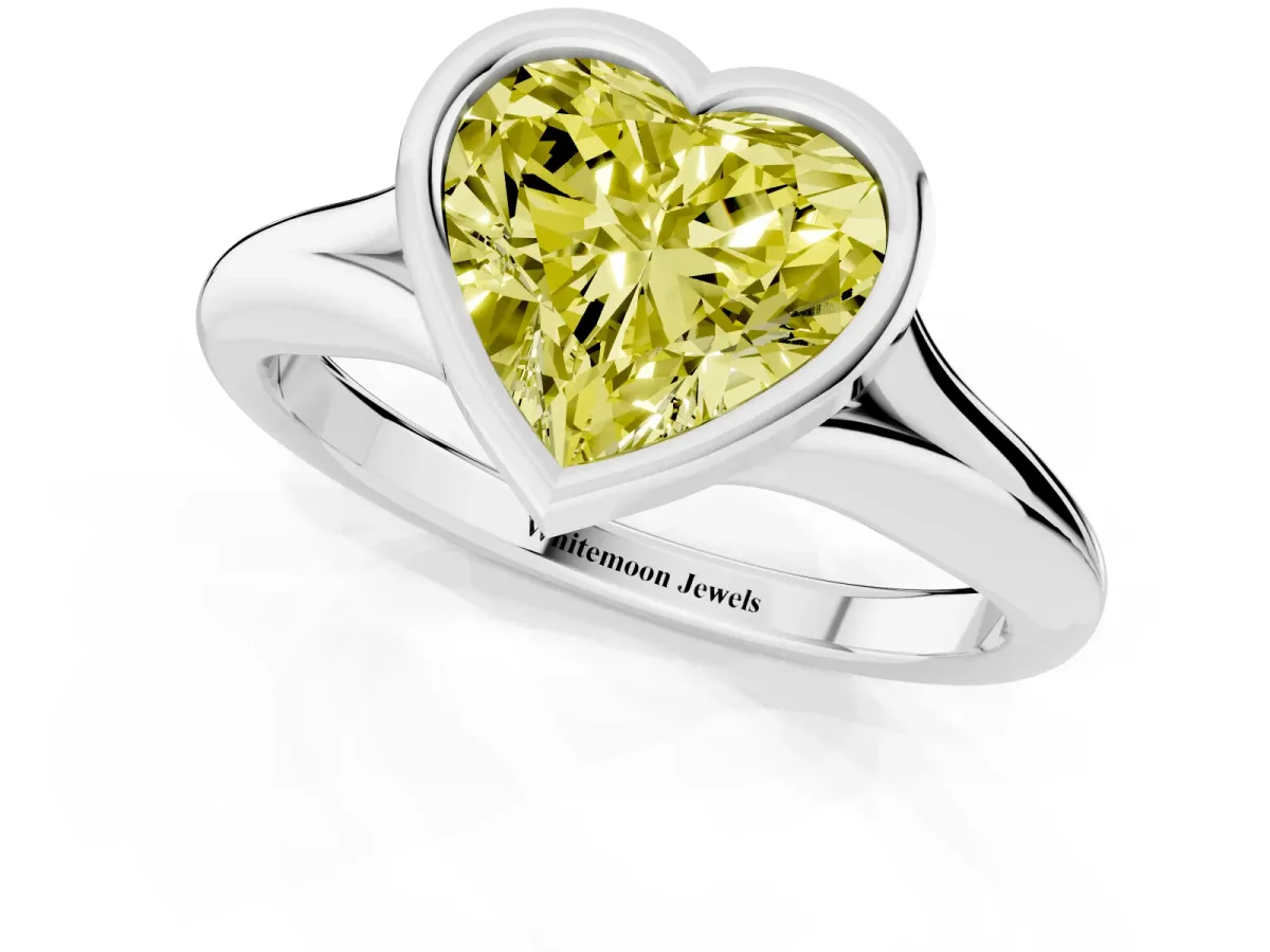 Fancy Yellow Bezel Set Heart Cut Solitaire Diamond Ring with Smooth Band Silver