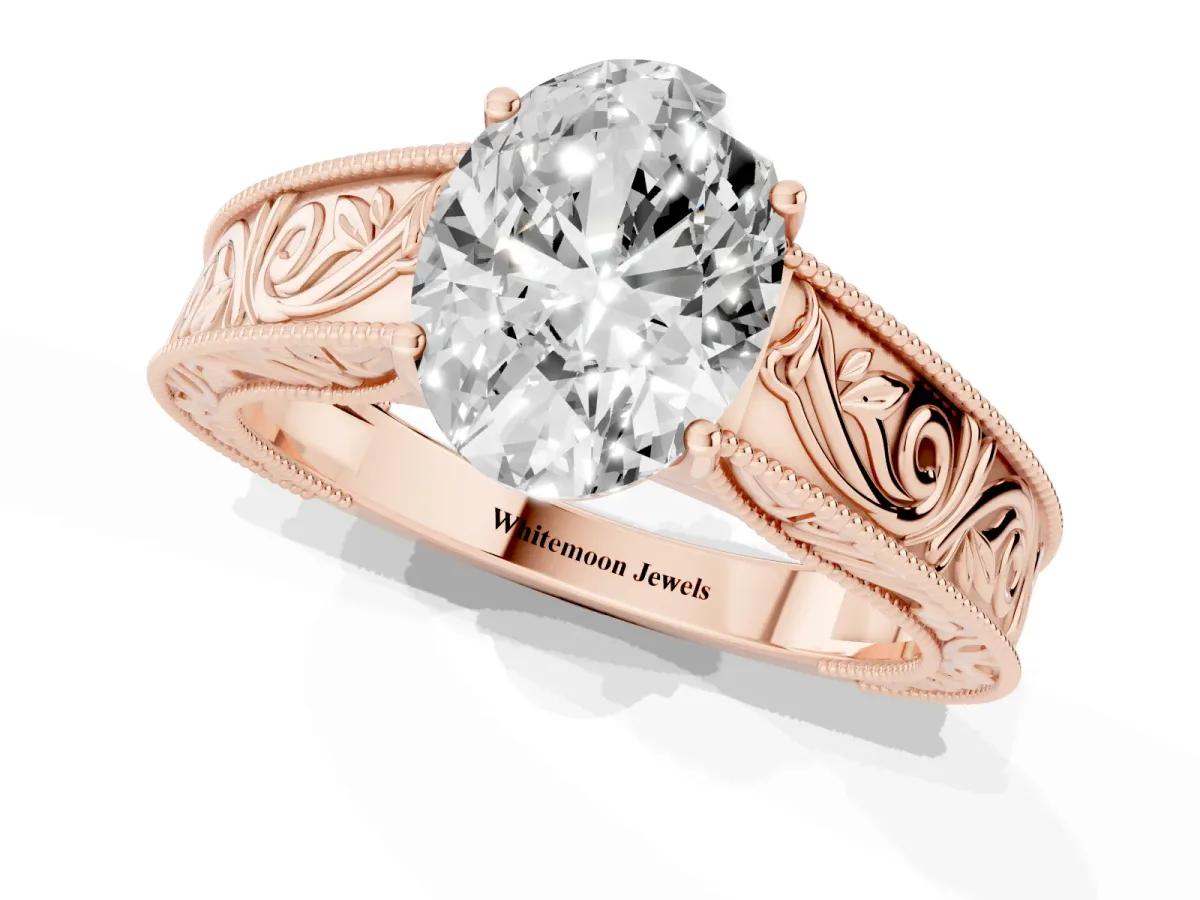 Oval Cut Diamond Solitaire Ring with Engraved Band and Four-Prong Setting Rose gold