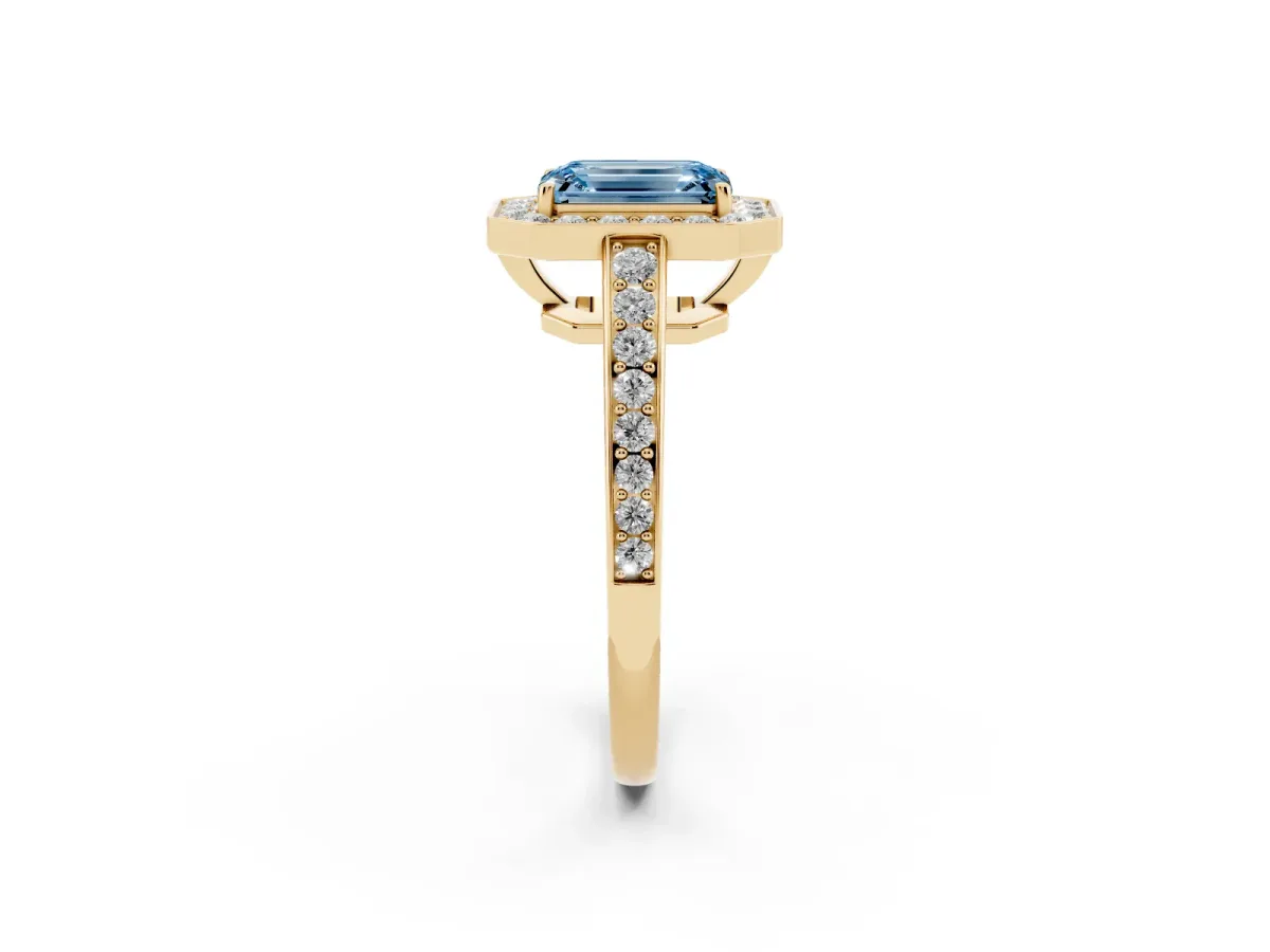 Fancy Blue Emerald Cut Halo Pavé Diamond Engagement Ring with Bezel Setting Yellow gold