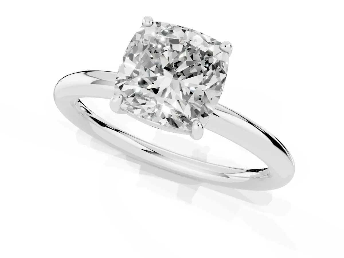 Cushion Cut Solitaire Diamond Ring with Four-Prong Setting on a Plain Band Platinum