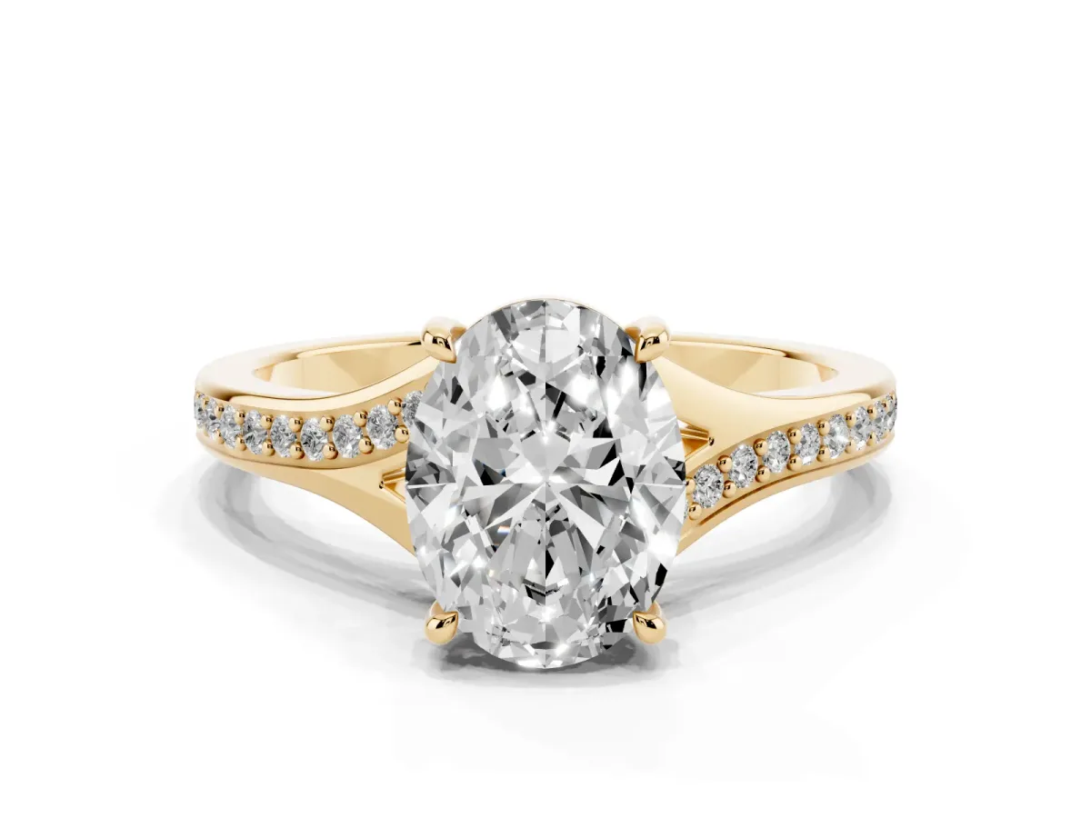 Oval Cut Diamond Solitaire Ring with Pavé Band and Prong Setting Yellow gold