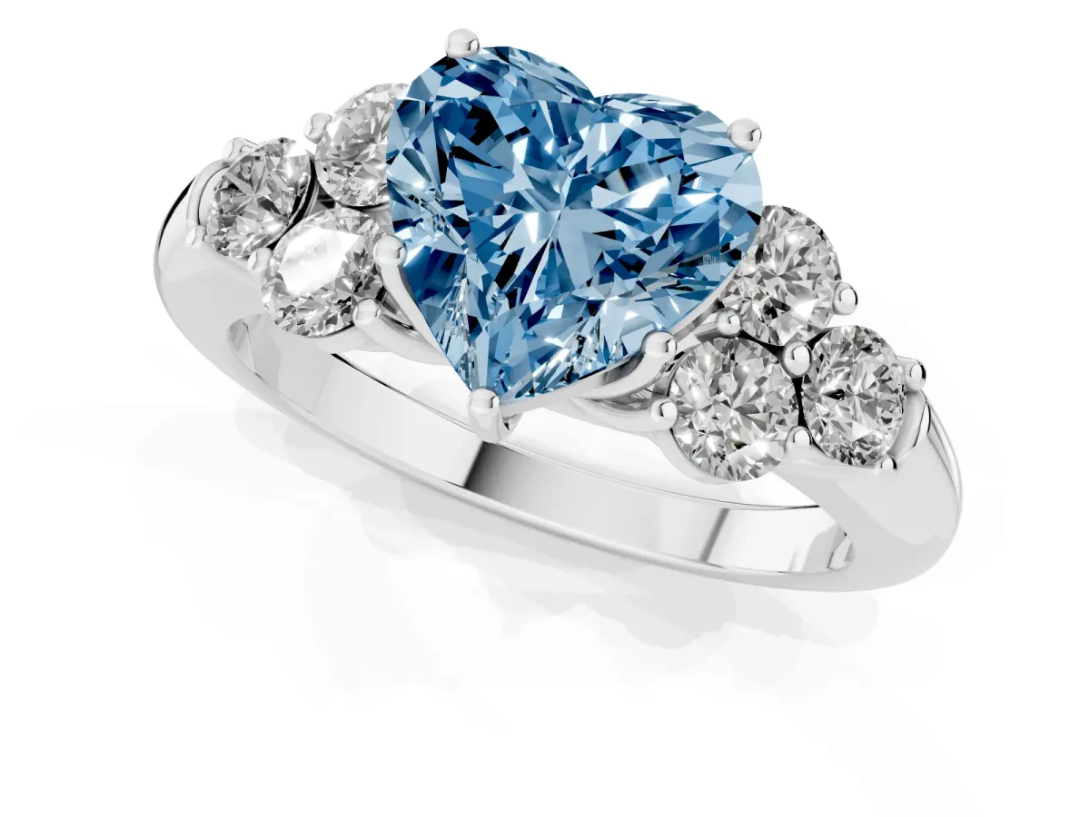 Fancy Blue Heart Cut Cut Diamond Cluster Ring with Round Accent Stones and Prong Setting on a Classic Band White gold