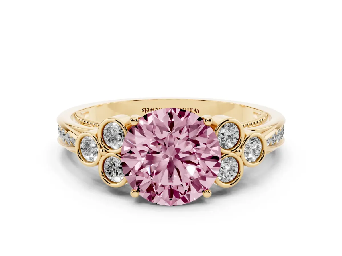 Fancy Pink Round Cut Cut Diamond Engagement Ring with Bezel Set Round Side Stones and Prong Setting Yellow gold