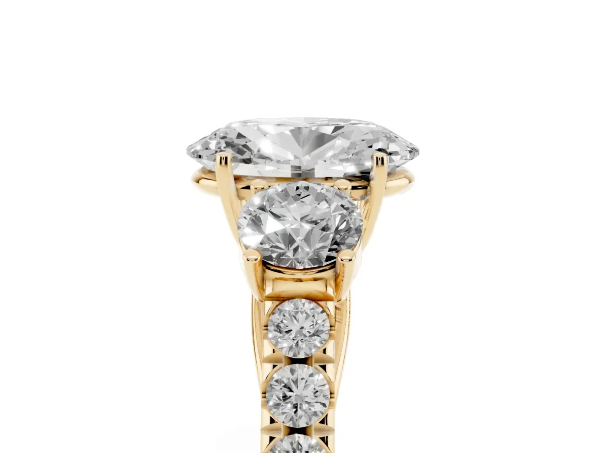 Oval Cut Cut Diamond Three-Stone Ring with Round Side Stones and Pavé Band Yellow gold