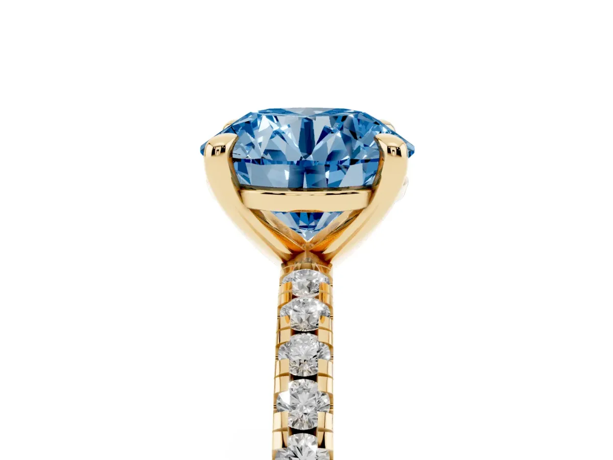 Fancy Blue Round Cut Diamond Brilliant Solitaire Ring with Pavé Band and Four-Prong Setting Yellow gold