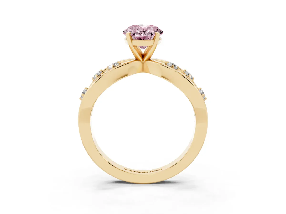 Fancy Pink Oval Cut Cut Solitaire Diamond with Side Stones on Criss-Cross Band and Four-Prong Setting Yellow gold