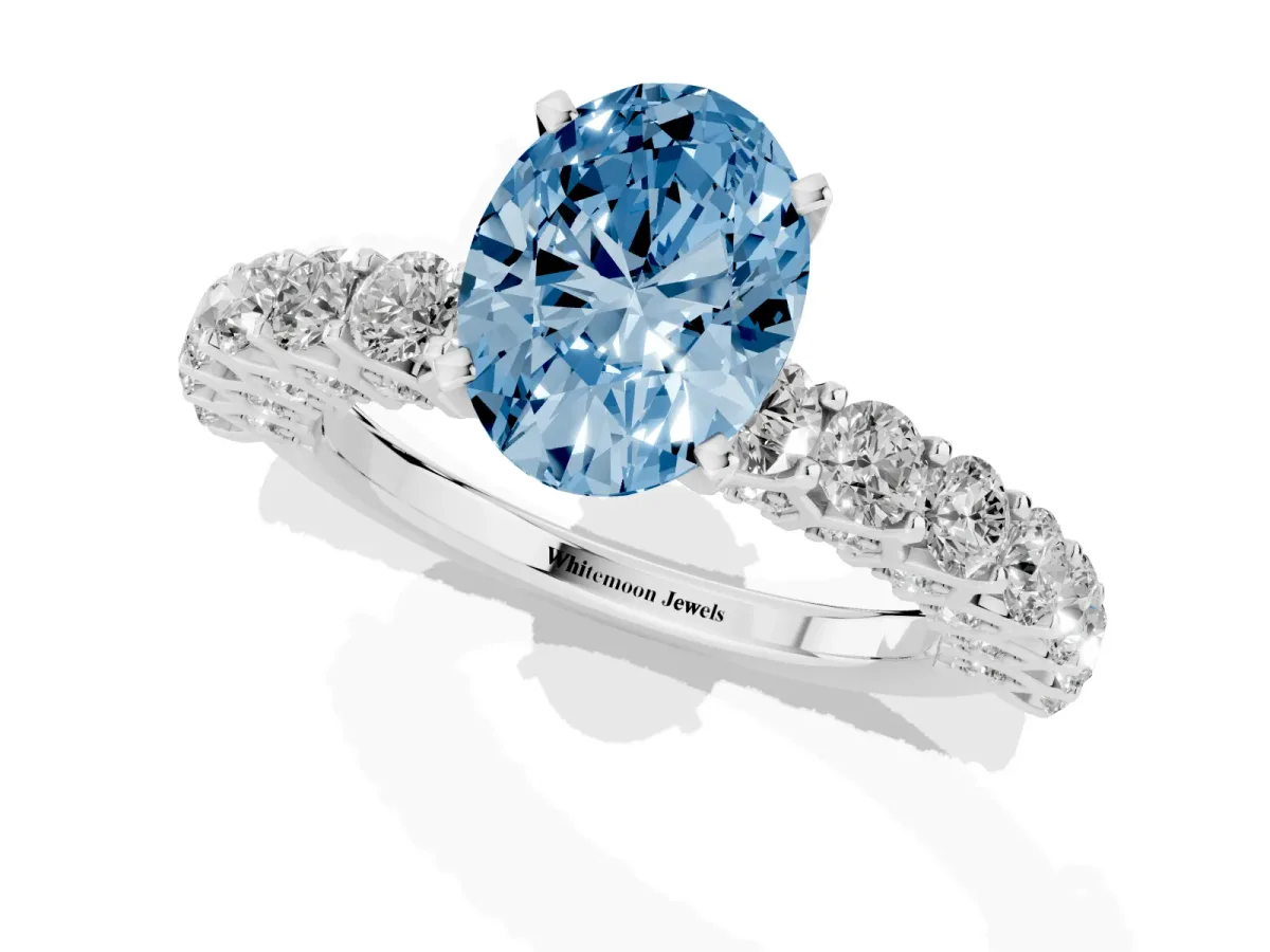 Fancy Blue Oval Cut Diamond Solitaire Ring with Shared Prong Pavé Band and Four-Prong Setting Silver