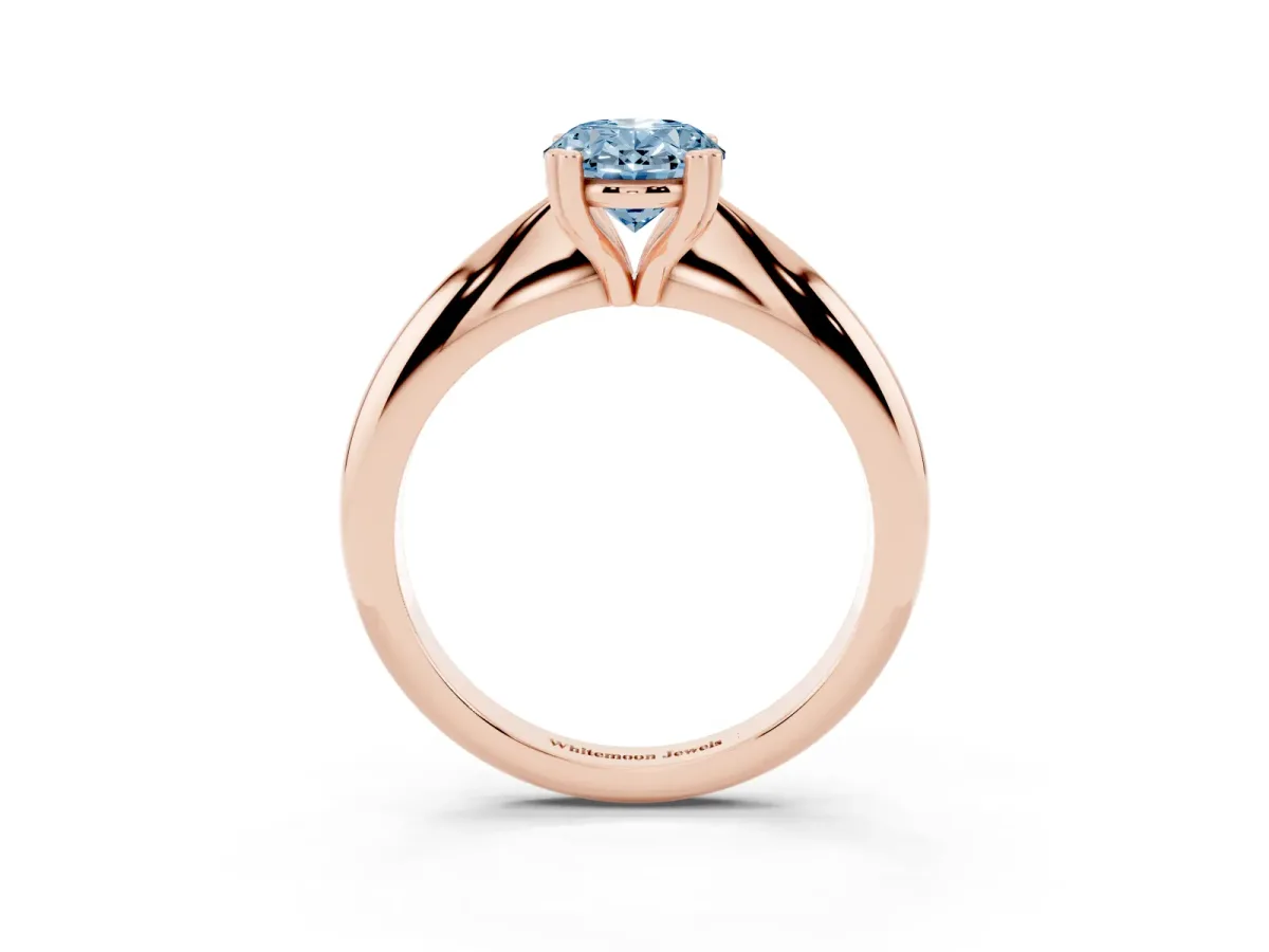 Fancy Blue Oval Cut Cut Solitaire Engagement Ring with Tapered Band and Four-Prong Setting Rose gold