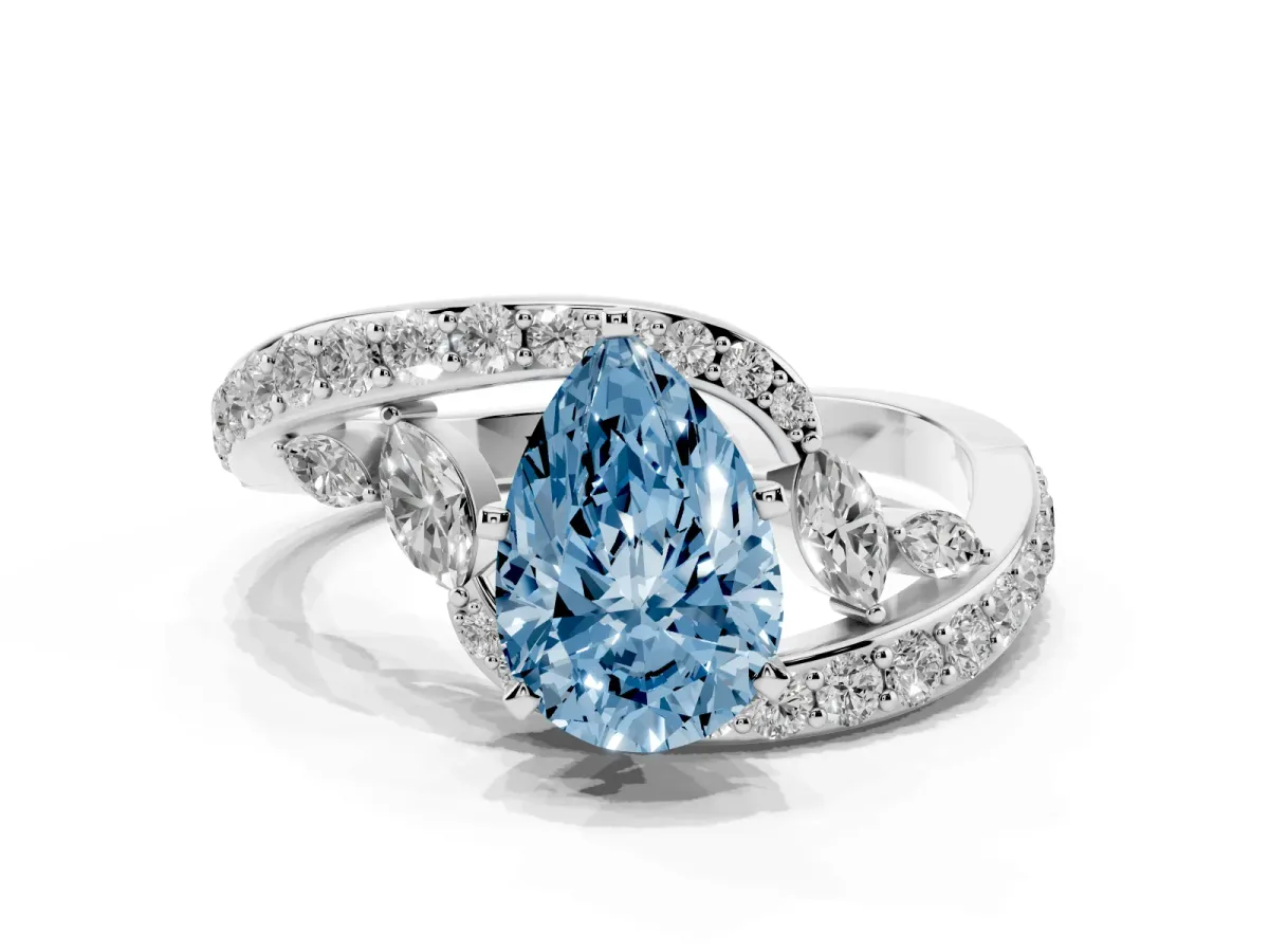 Fancy Blue Pear Cut Solitaire with Pavé Twist Band and Four-Prong Setting Silver