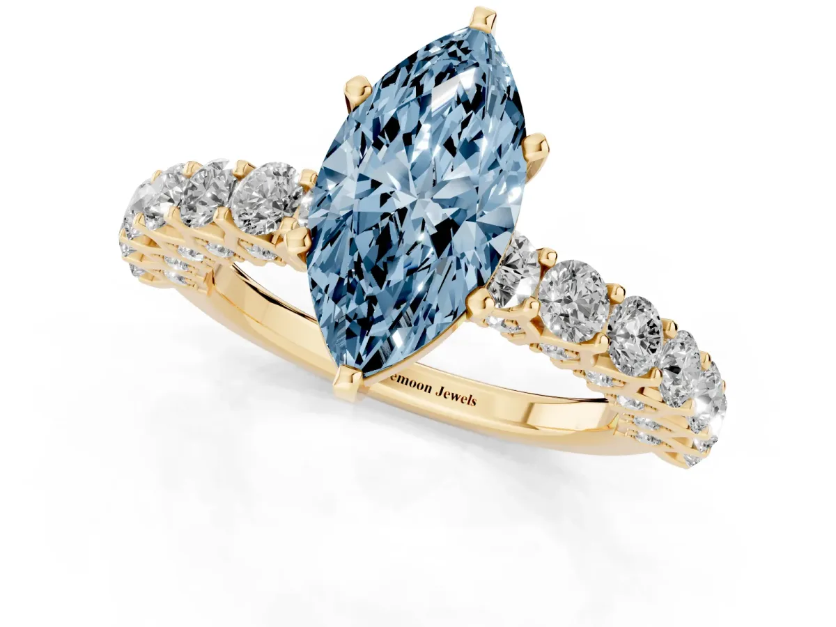Fancy Blue Marquise Cut Diamond Solitaire Ring with Shared Prong Pavé Band and Four-Prong Setting Yellow gold