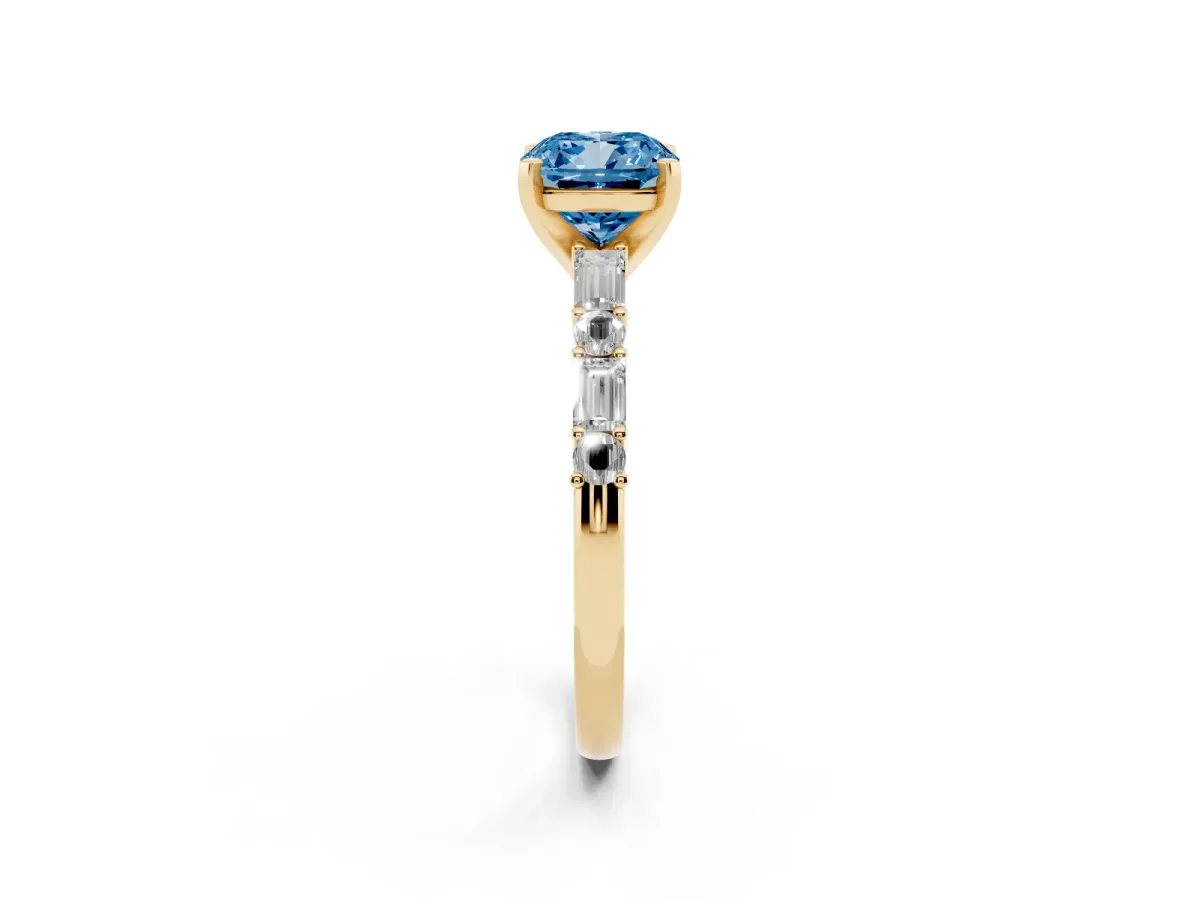 Fancy Blue Cushion Cut Diamond Solitaire with Side Baguettes and Channel Set Band Yellow gold