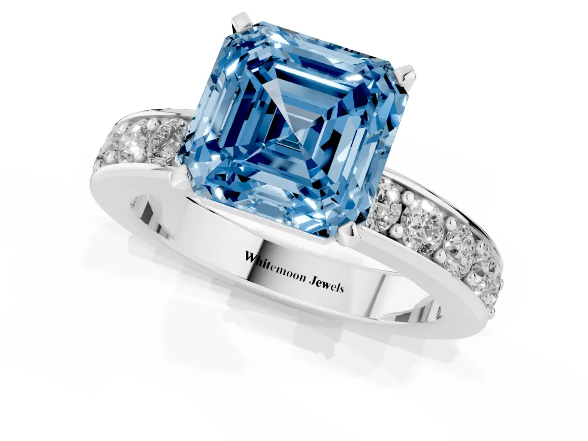 Fancy Blue Asscher Cut Diamond Engagement Ring with Channel Set Round Band and Prong Setting Silver