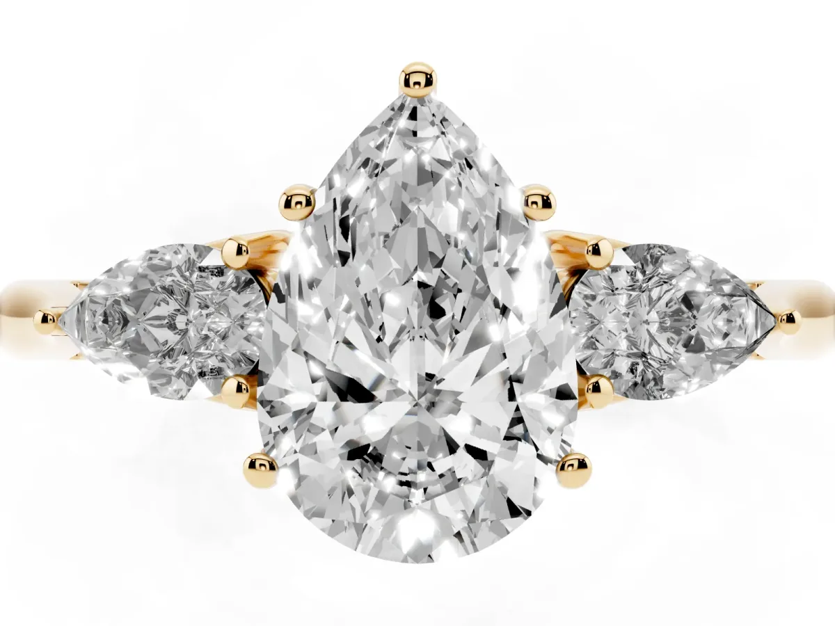 Pear Cut Diamond Three-Stone Ring with Pear Side Stones and Prong Setting Yellow gold