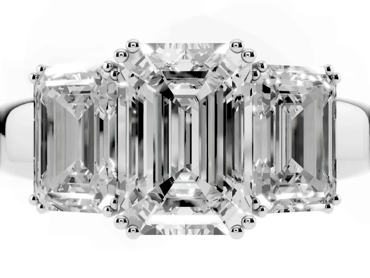 Three-Stone Emerald Cut Cut Diamond Ring with Channel Set Band and Four-Prong Setting Platinum