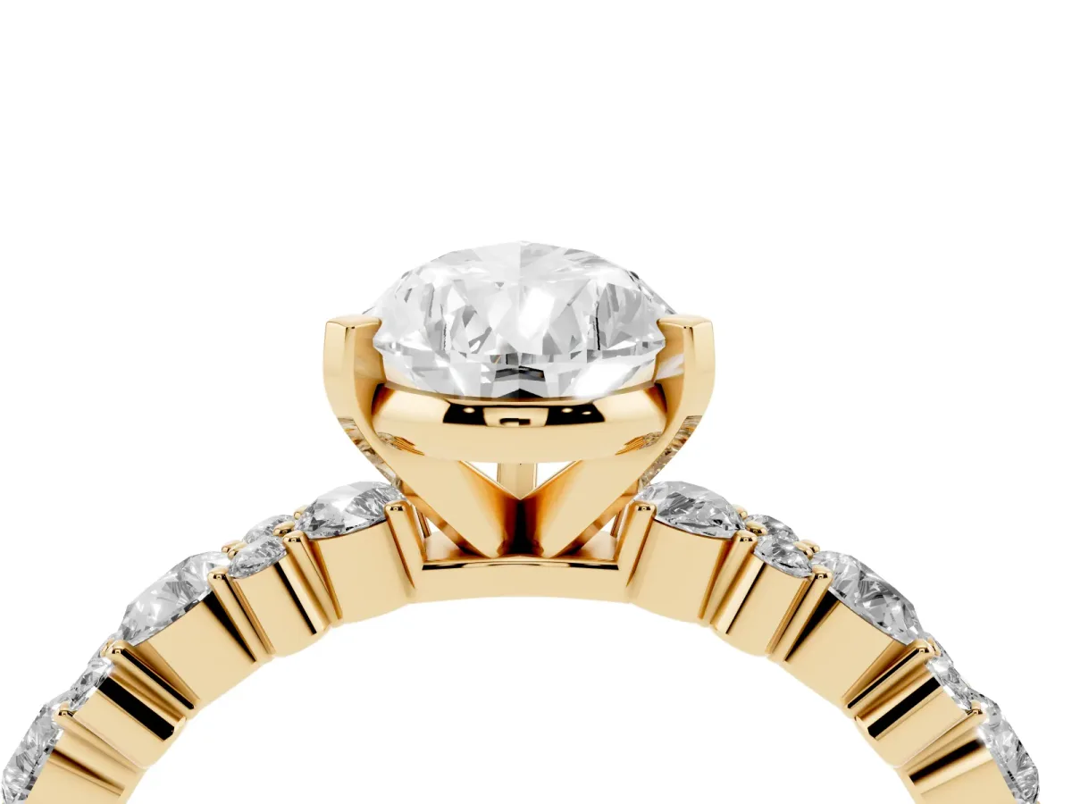 Pear Cut Diamond Side Stone Solitaire Ring with Round and Four-Prong Setting Yellow gold