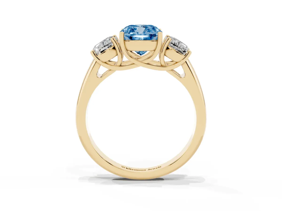 Fancy Blue Three-Stone Cushion Cut Diamond Engagement Ring with Prong Setting Yellow gold