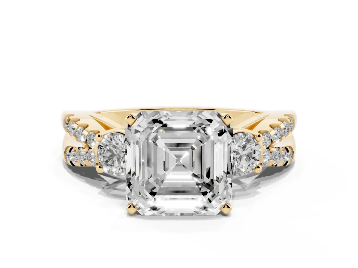 Asscher Cut Diamond Three-Stone Ring with Pavé Split Shank and Four-Prong Setting Yellow gold