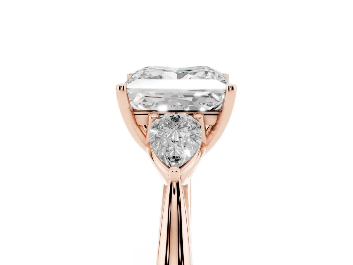 Three-Stone Princess Cut Diamond Ring with Pear Side Stones in Four-Prong Setting Rose gold