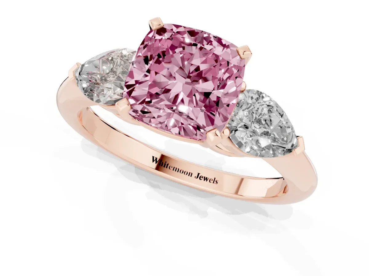 Fancy Pink Three-Stone Cushion Cut Diamond Ring with Pear Side Stones and Four-Prong Setting Rose gold