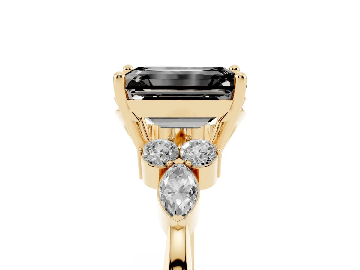 Fancy Black Emerald Cut Brilliant Diamond Solitaire Ring with Pear Side Stones and Four-Prong Setting Yellow gold