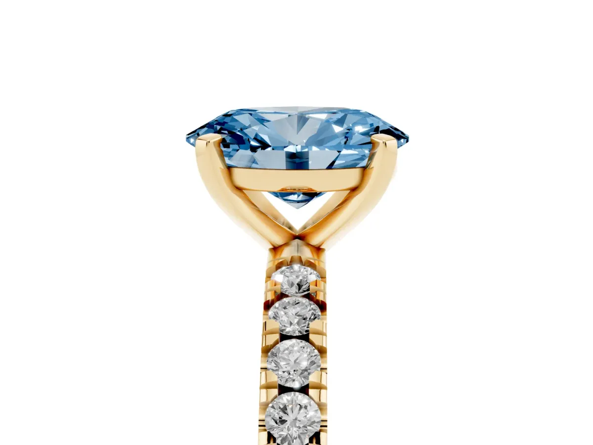Fancy Blue Oval Cut Diamond Pavé Band Solitaire with Four-Prong Setting Yellow gold