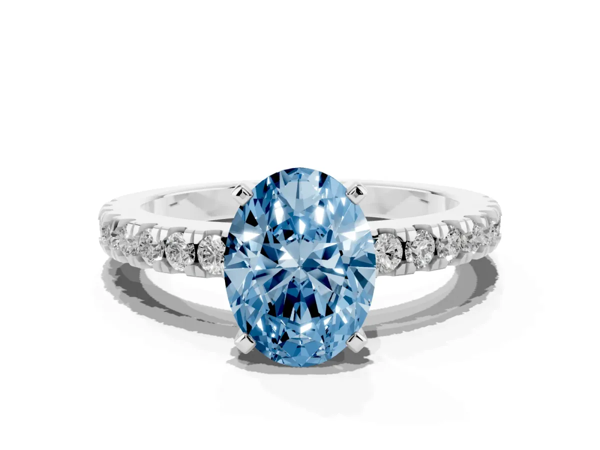 Fancy Blue Oval Cut Solitaire Diamond with Pavé Band and Four-Prong Setting Silver