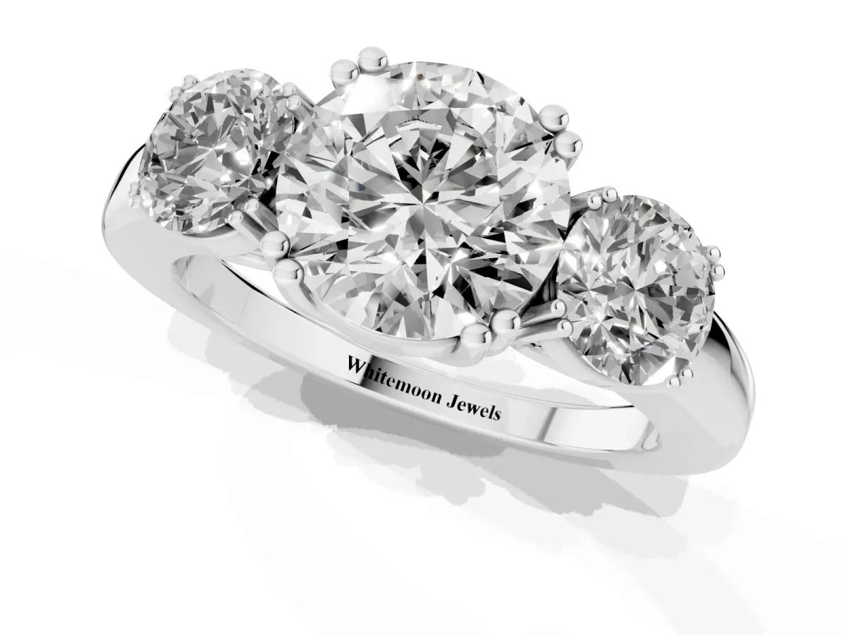 Three-Stone Round Cut Cut Diamond Ring with Channel Set Band and Four-Prong Setting Silver