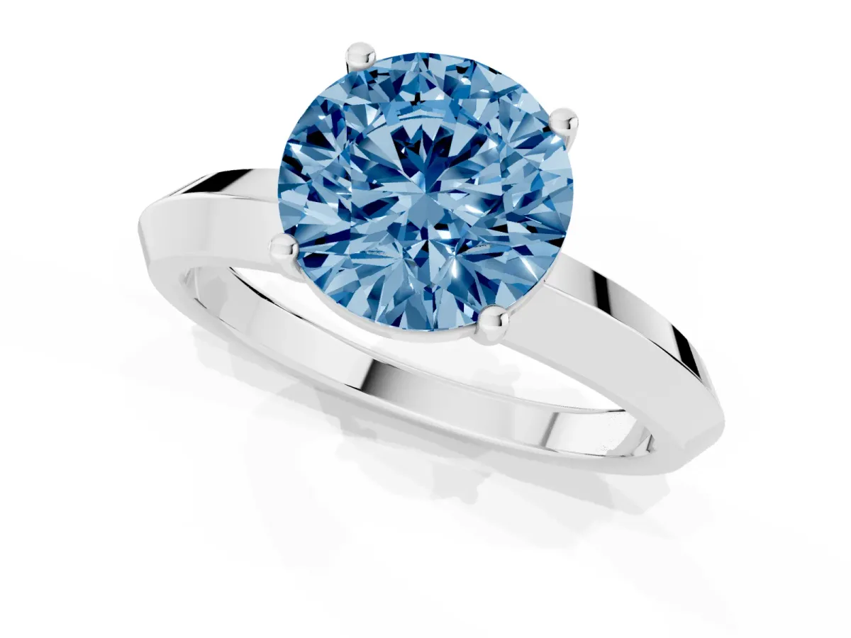 Fancy Blue Round Cut Cut Solitaire Engagement Ring with Flat Band and Four-Prong Setting Silver