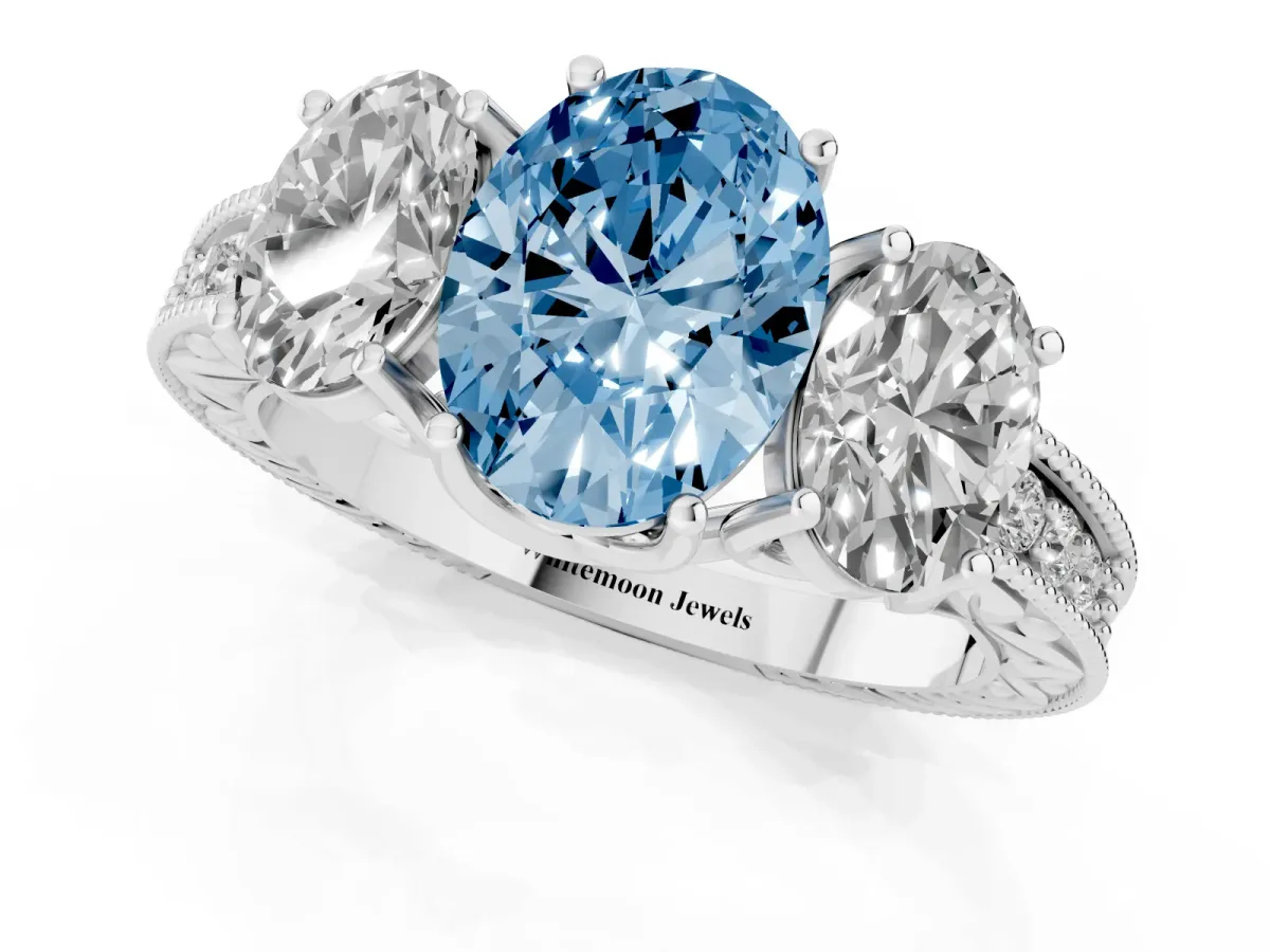 Fancy Blue Three-Stone Oval Cut Cut Milgrain Pavé Engagement Ring Platinum