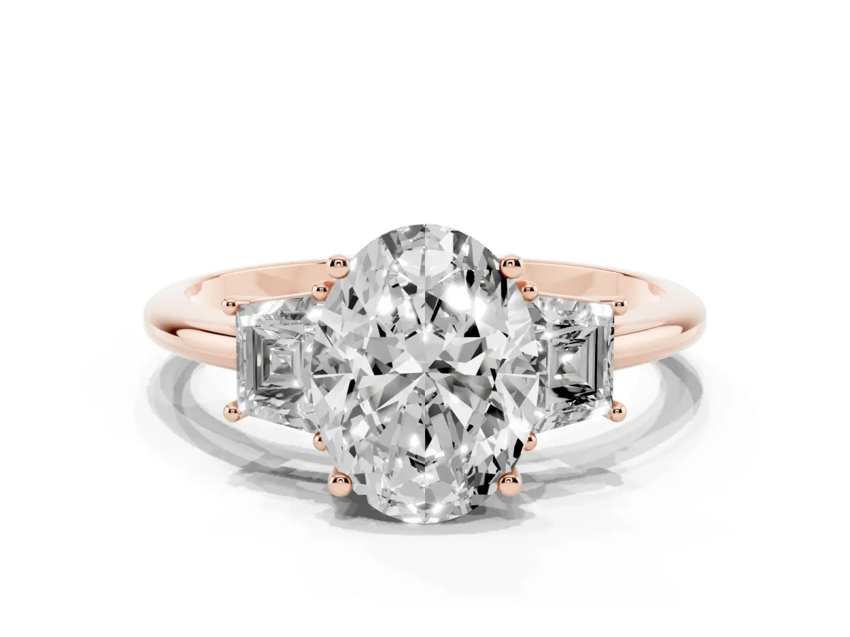 Oval Cut Diamond Three-Stone Ring with Trapezoid Side Stones and Prong Setting Rose gold
