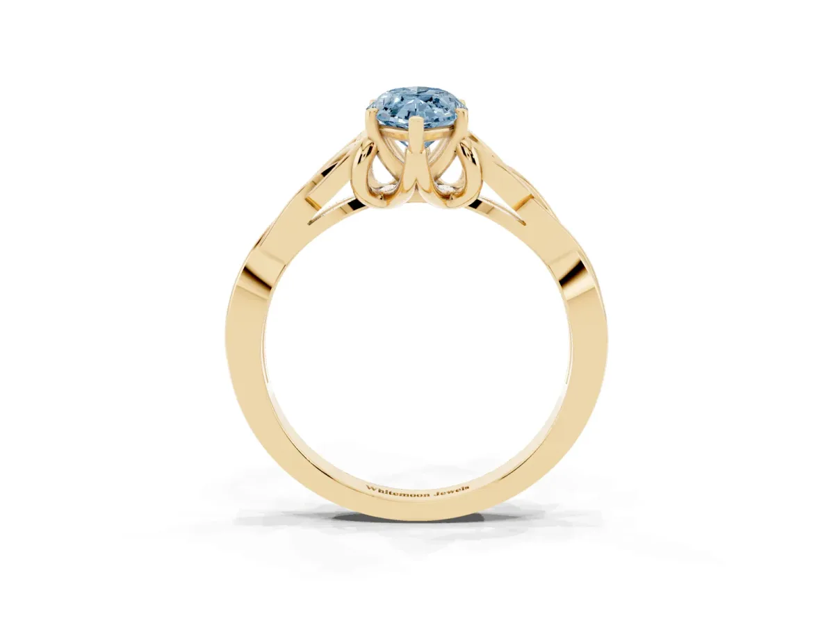 Fancy Blue Marquise Cut Diamond Solitaire Engagement Ring with Celtic Knot Band and Four-Prong Setting Yellow gold
