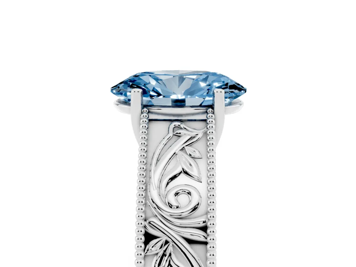Fancy Blue Oval Cut Diamond Solitaire Ring with Engraved Band and Four-Prong Setting Silver