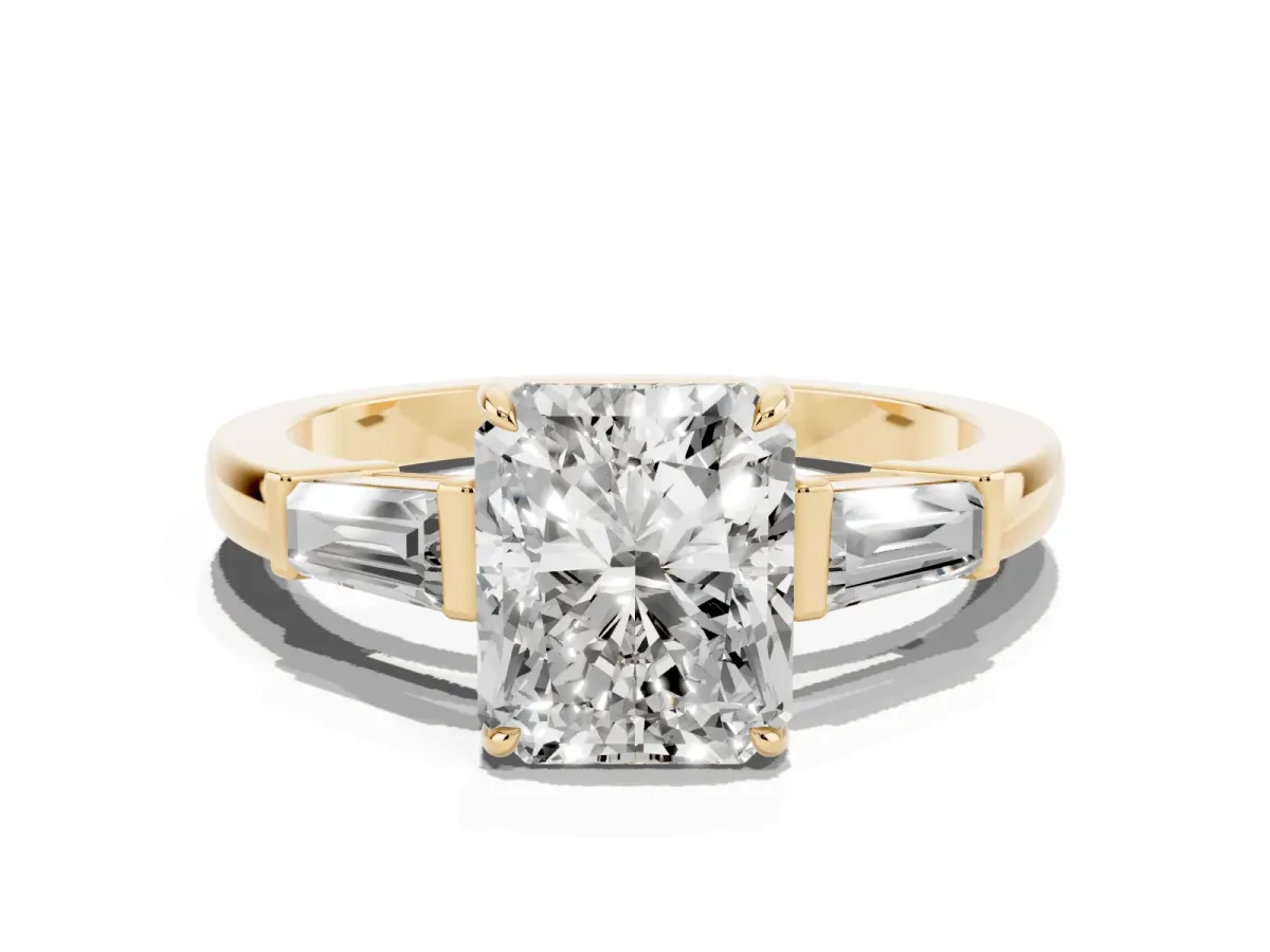 Radiant Cut Diamond Three-Stone Ring with Tapered Baguette Side Stones and Prong Setting Yellow gold