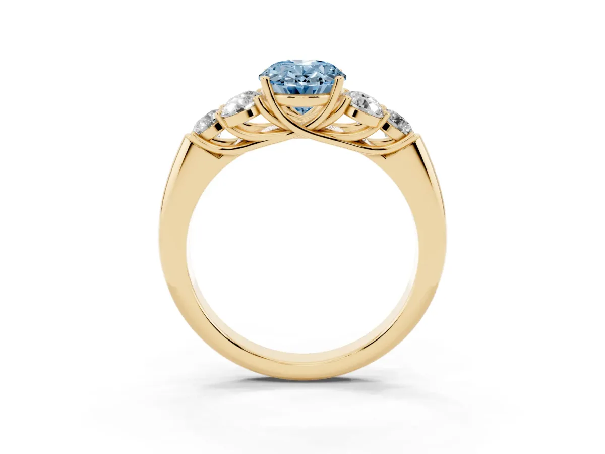 Fancy Blue Oval Cut Cut Diamond Cluster Ring with Round Accent Stones and Prong Setting on a Classic Band Yellow gold