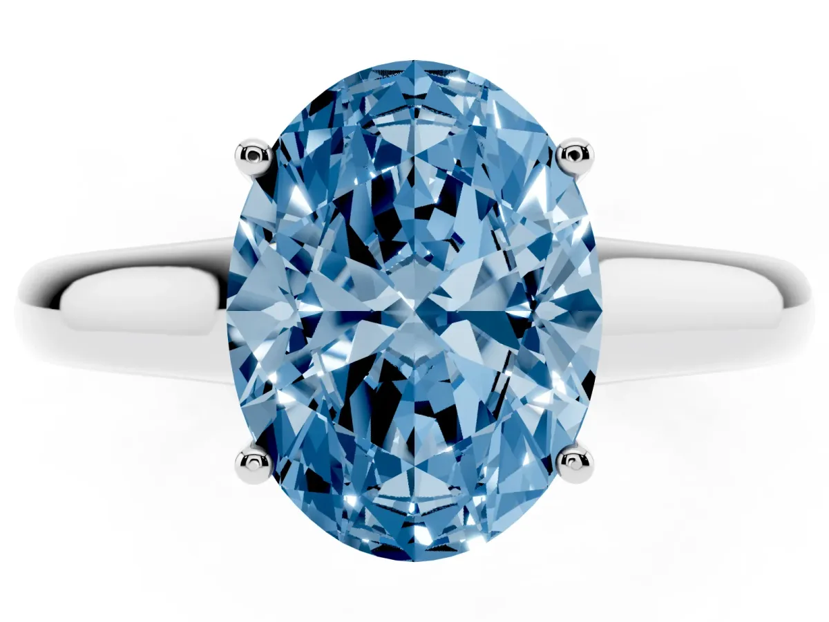 Fancy Blue Oval Cut Solitaire Engagement Ring with Tapered Band and Four-Prong Setting Silver