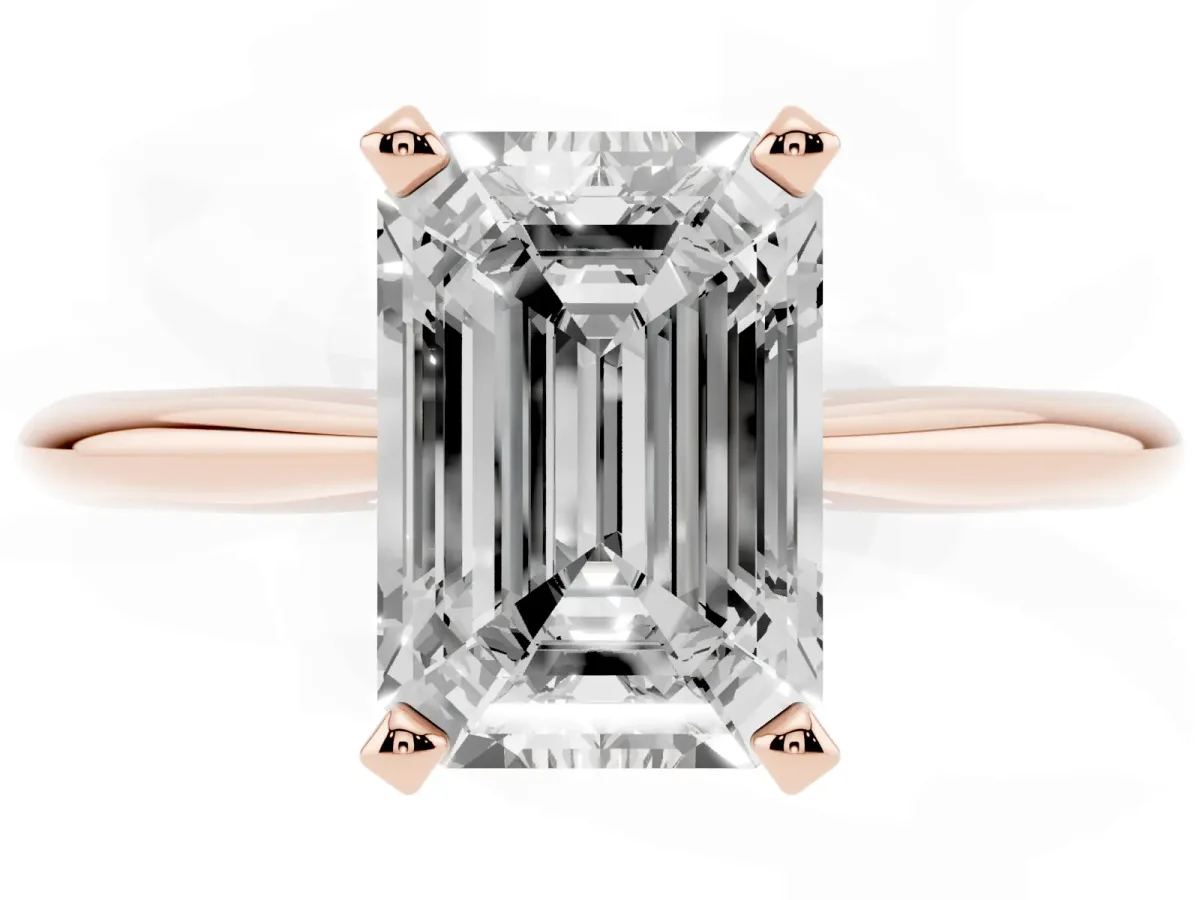 Emerald Cut Cut Solitaire Ring with Four-Prong Setting on a Classic Band Rose gold