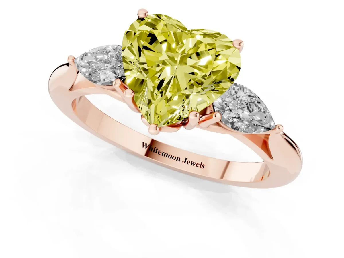 Fancy Yellow Three-Stone Heart Cut Diamond Ring with Pear Side Stones in Four-Prong Setting Rose gold