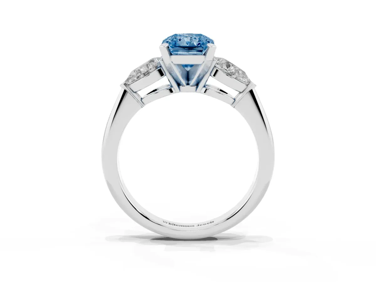 Fancy Blue Three-Stone Radiant Cut Diamond Ring with Pear Side Stones and Four-Prong Setting Platinum