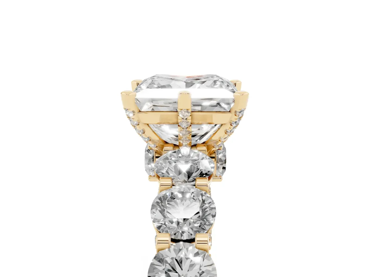 Princess Cut Diamond Side Stone Engagement Ring with Four-Prong Setting Yellow gold