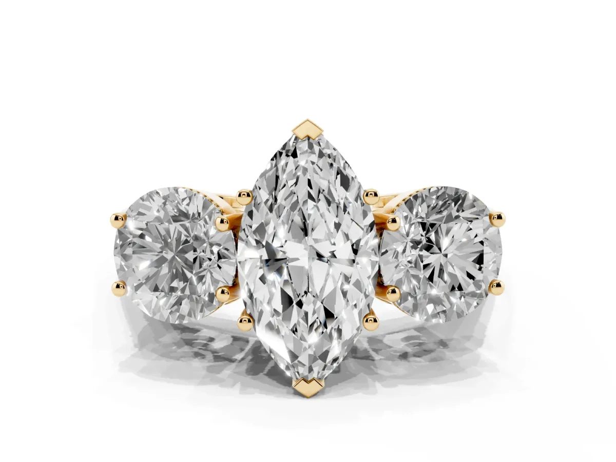 Three-Stone Marquise Cut Diamond Engagement Ring with Prong Setting on a Classic Band Yellow gold