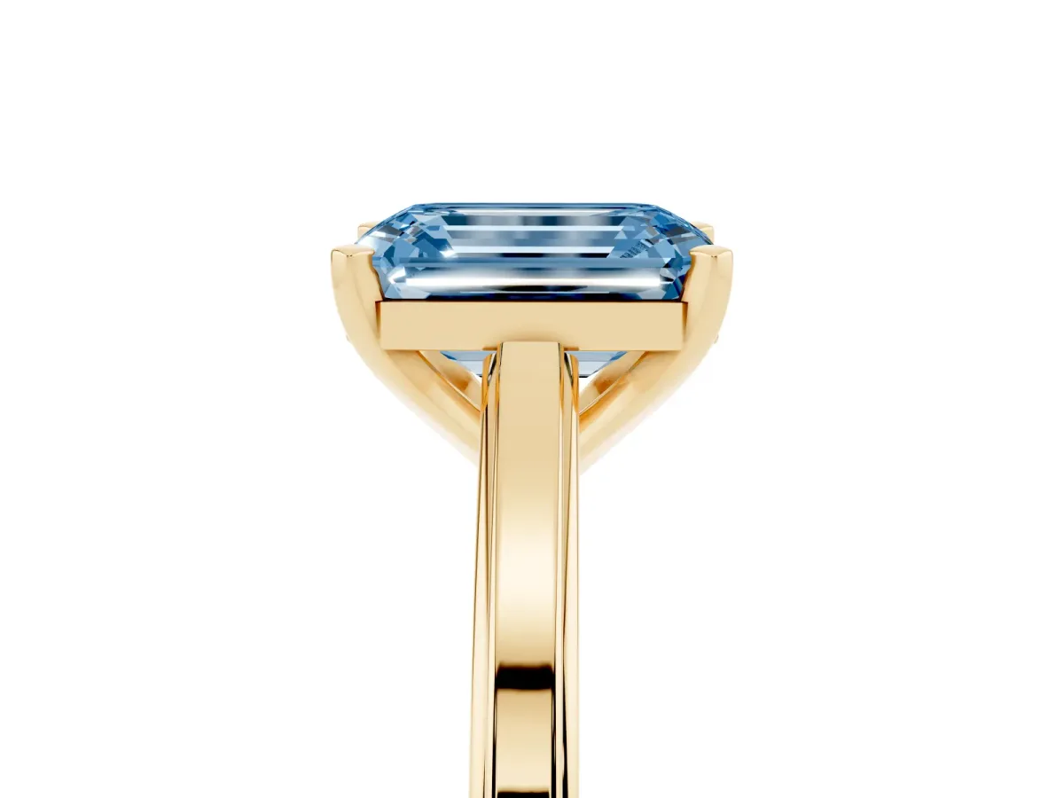 Fancy Blue Emerald Cut Solitaire Diamond Ring with Four-Prong Setting and Classic Band Yellow gold