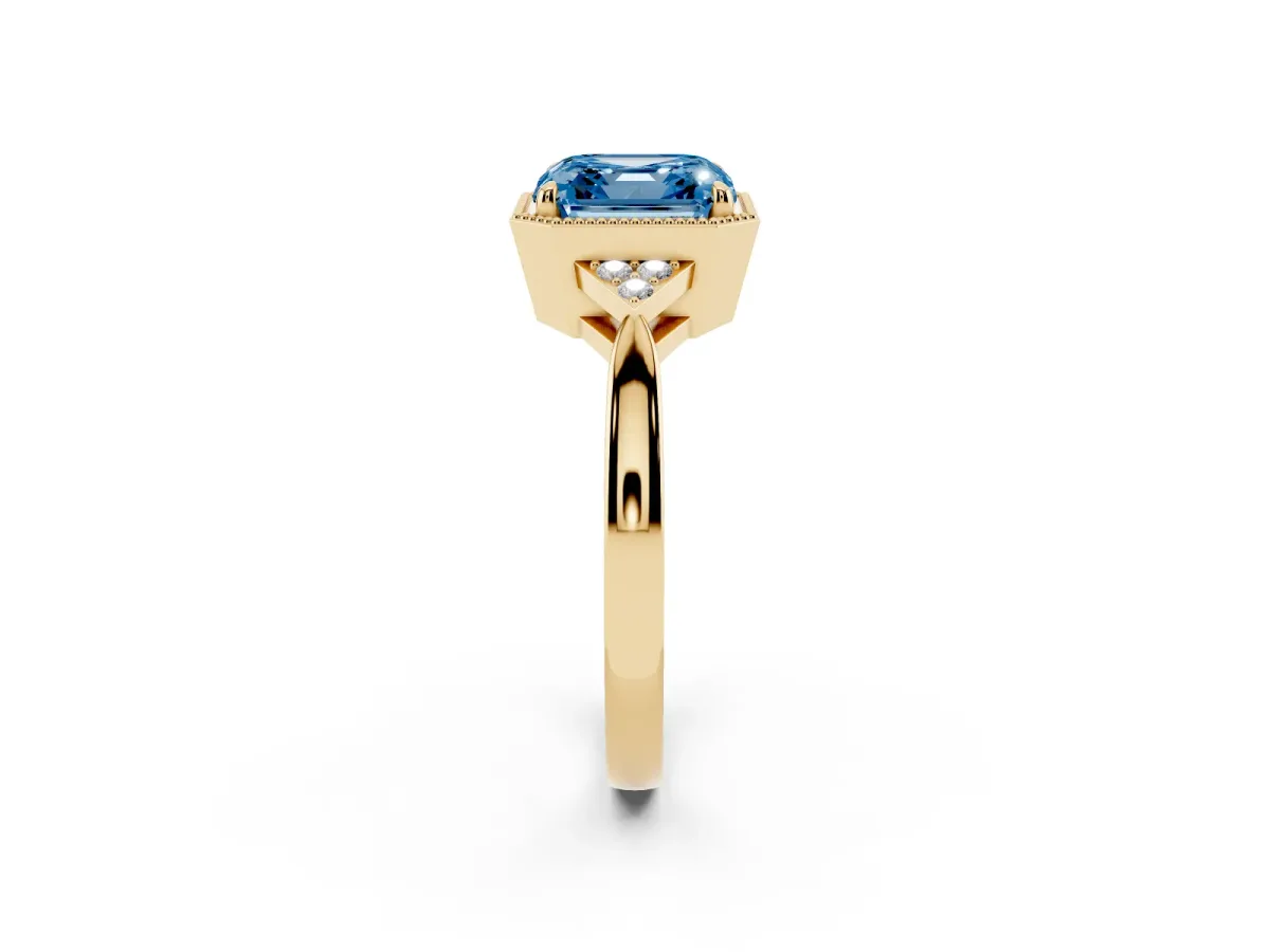 Fancy Blue Milgrain Asscher Cut Cut Diamond Ring with Tapered Pave Band and Four Prong Setting Yellow gold
